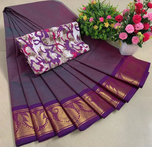 Purple saree with gold border and floral arrangement on a light background